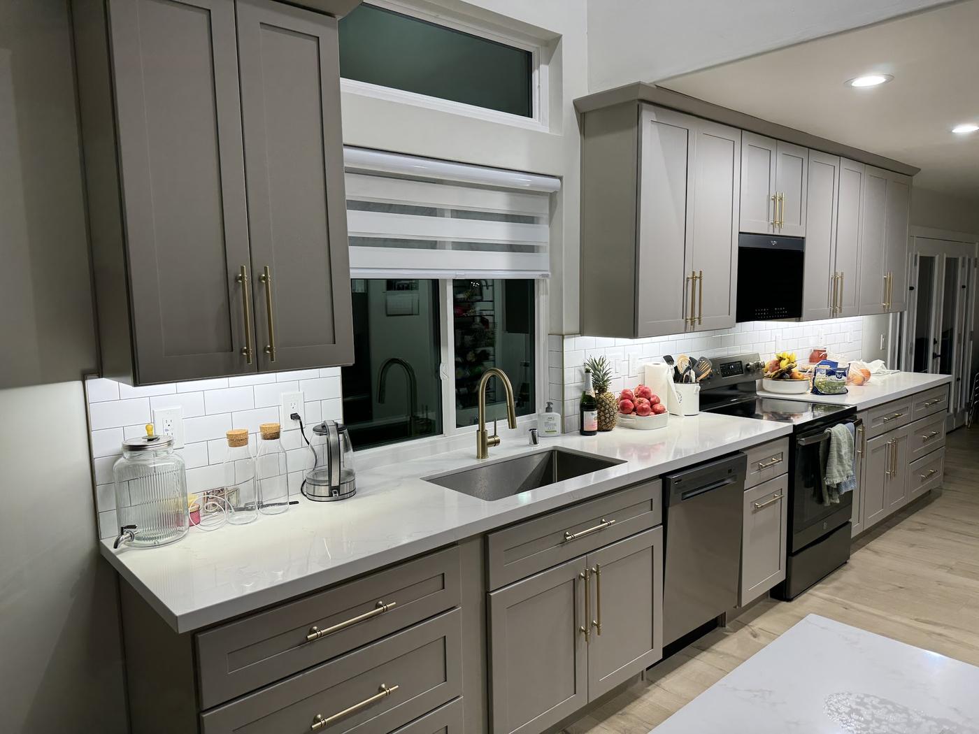 Remodeled kitchen with under-cabinet lighting and recessed ceiling lights