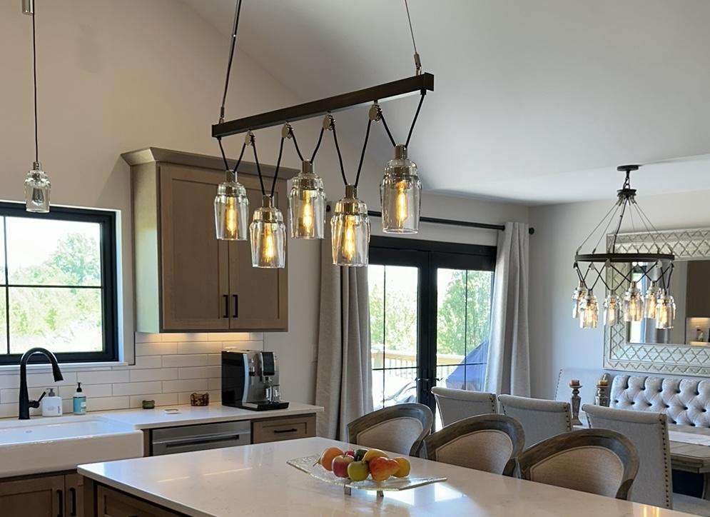 Kitchen island with a five-light pendant fixture over the counter